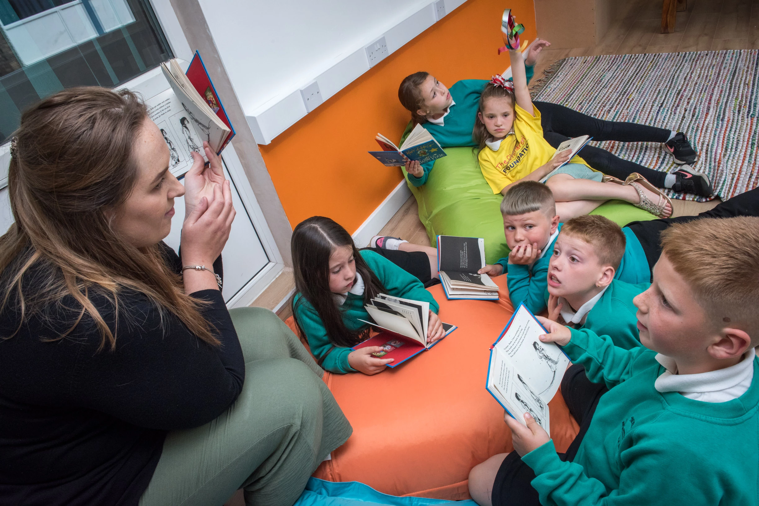 Students at Tyneview Primary being read to in the 'Reading Rocks Shed'.