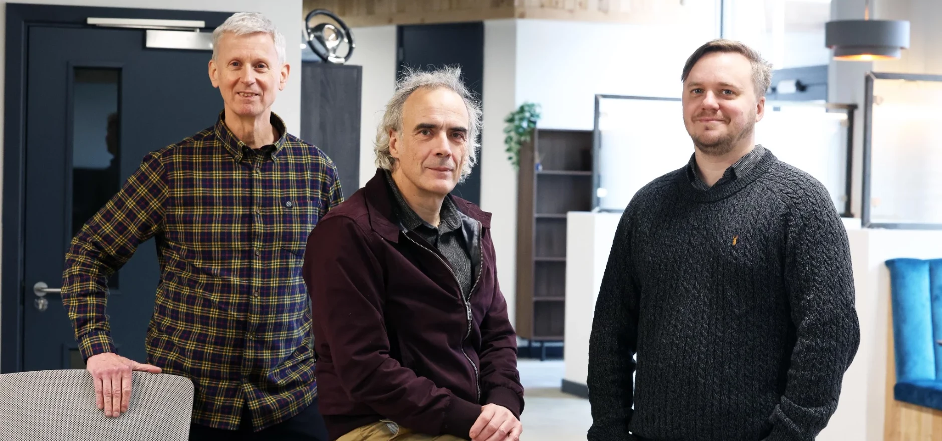 A photograph of Graham Clemow, Sam Manning and Jonathan Roberts stood together.